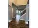 Inviting foyer with hardwood floors and staircase leading to the upper level of the home at 14914 Annabel Ct, Westfield, IN 46074