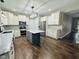 Modern kitchen featuring white cabinets, a center island, stainless steel appliances, and ample counter space at 14914 Annabel Ct, Westfield, IN 46074