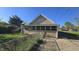 Rear view featuring enclosed porch and yard with chain link fence at 4745 W Legrande Ave, Indianapolis, IN 46241