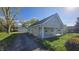 Traditional style home with a two-car detached garage and covered porch at 4745 W Legrande Ave, Indianapolis, IN 46241