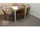 Basement features a small table and three chairs at 7317 Lions Head Dr # 2, Indianapolis, IN 46260