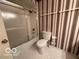 Clean bathroom with toilet and shower/tub combo at 7317 Lions Head Dr # 2, Indianapolis, IN 46260