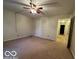 Spacious bedroom with ceiling fan and carpet at 7317 Lions Head Dr # 2, Indianapolis, IN 46260