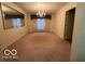 Spacious dining room with chandelier and large mirror at 7317 Lions Head Dr # 2, Indianapolis, IN 46260