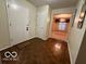 Bright entryway with parquet flooring and view to dining room at 7317 Lions Head Dr # 2, Indianapolis, IN 46260