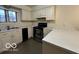 Kitchen boasts stainless steel appliances and an abundance of cream cabinets at 7317 Lions Head Dr # 2, Indianapolis, IN 46260