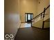 Building entrance with staircase and tiled floor at 7317 Lions Head Dr # 2, Indianapolis, IN 46260