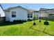 A lush and well-manicured backyard features an outdoor area with seating and ample room at 11218 Boston Way, Fishers, IN 46038