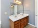 Bathroom featuring a double sink vanity with a mirror at 11218 Boston Way, Fishers, IN 46038