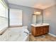 Bathroom featuring a jacuzzi tub, tile floors, and double sink vanity at 11218 Boston Way, Fishers, IN 46038