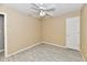 Neutral bedroom with tile floors, a ceiling fan, and a window at 11218 Boston Way, Fishers, IN 46038