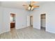 Light filled bedroom features tile floors and ensuite bathroom and closet at 11218 Boston Way, Fishers, IN 46038