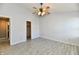 Spacious bedroom with tile flooring and entrances to a closet and bathroom at 11218 Boston Way, Fishers, IN 46038