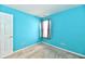 Bright bedroom with turquoise walls and carpet flooring at 11218 Boston Way, Fishers, IN 46038