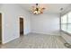 Light filled bedroom features tile floors and ensuite bathroom and closet at 11218 Boston Way, Fishers, IN 46038