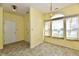 Sunny dining area with large windows and neutral-colored walls at 11218 Boston Way, Fishers, IN 46038