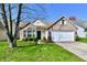 Charming single-Gathering home with brick accents, a well-manicured lawn, and a two-car garage at 11218 Boston Way, Fishers, IN 46038