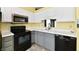 Well-lit kitchen featuring modern appliances at 11218 Boston Way, Fishers, IN 46038