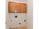 Laundry room with essential hookups and overhead cabinets for storage at 11218 Boston Way, Fishers, IN 46038