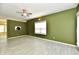Modern living room with tile floors, a ceiling fan, and neutral color palette creating inviting space at 11218 Boston Way, Fishers, IN 46038