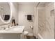 Updated bathroom with marble tile and modern vanity at 1529 Harlan St, Indianapolis, IN 46203