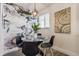 Charming dining area with floral wallpaper and glass-top dining table at 1529 Harlan St, Indianapolis, IN 46203
