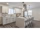 Modern kitchen with white cabinets, quartz countertops, and stainless steel appliances at 1529 Harlan St, Indianapolis, IN 46203