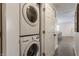 Stackable washer and dryer in a bright laundry room at 1529 Harlan St, Indianapolis, IN 46203