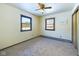 Cozy bedroom with ceiling fan, window, and carpeted floor at 2879 S 380 E, Anderson, IN 46017