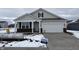 New construction home with gray siding and a two-car garage at 5226 Woodhurst Ln, Indianapolis, IN 46239