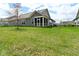 Lovely backyard with ample green space, a screened-in porch, and well-maintained lawn at 17345 Northam Dr, Westfield, IN 46074