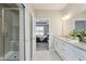 A well-lit bathroom features a shower and double vanity, with an open door to the bedroom at 17345 Northam Dr, Westfield, IN 46074