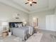 Serene bedroom with tray ceiling, neutral walls, and coordinated decor for a calming retreat at 17345 Northam Dr, Westfield, IN 46074