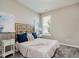 Cozy bedroom with a soft rug, a window with blinds, and decorative bedside tables with lamps at 17345 Northam Dr, Westfield, IN 46074