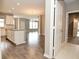Open concept kitchen features an island, modern cabinets, and wood-look flooring at 17345 Northam Dr, Westfield, IN 46074