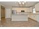 Bright kitchen featuring white cabinets, stainless steel appliances, hardwood floors, and an island with bar seating at 17345 Northam Dr, Westfield, IN 46074