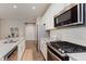 Modern kitchen features stainless steel appliances, subway tile backsplash, and light gray countertops at 17345 Northam Dr, Westfield, IN 46074