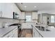 Bright kitchen with white cabinets, stainless steel appliances, and a stylish subway tile backsplash at 17345 Northam Dr, Westfield, IN 46074