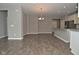 Open-concept space featuring hardwood floors, a large island, stainless steel appliances, and abundant natural light at 17345 Northam Dr, Westfield, IN 46074