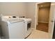 Laundry room with tile floor and front load washer and dryer at 17345 Northam Dr, Westfield, IN 46074