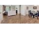 Open-concept living and dining area with hardwood floors and a cozy fireplace, great for gatherings at 17345 Northam Dr, Westfield, IN 46074