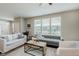 Bright and airy living room with large windows, comfortable seating, and stylish decor for relaxation at 17345 Northam Dr, Westfield, IN 46074