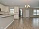 Open concept living room with view of the kitchen, dining room, and front door at 17345 Northam Dr, Westfield, IN 46074