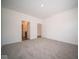 Well-lit bedroom with grey carpet and access to hallway bathroom at 5127 Cartland Dr, Indianapolis, IN 46239