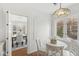 Charming breakfast nook with a white table and stained glass window at 5815 N Washington Blvd, Indianapolis, IN 46220