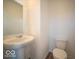 Simple half bathroom with pedestal sink and toilet at 6196 Granby Dr, Whitestown, IN 46075