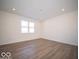 Simple bedroom with vinyl plank flooring and a window at 6196 Granby Dr, Whitestown, IN 46075