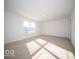 Spacious bedroom with carpeted floor and large window at 6196 Granby Dr, Whitestown, IN 46075