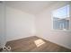 Spacious bedroom with large window and vinyl plank flooring at 6196 Granby Dr, Whitestown, IN 46075