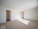 Spacious bedroom with neutral carpeting and large window at 6196 Granby Dr, Whitestown, IN 46075